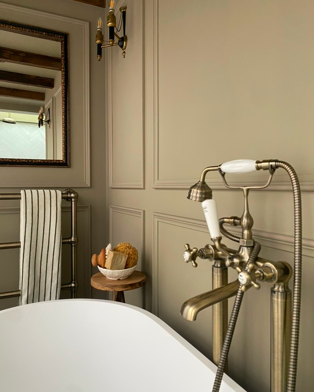 Elegant bathroom with freestanding tub and period fixtures